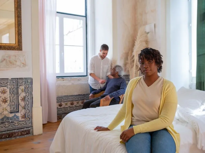 An overnight caregiver keeps watch in her client's home