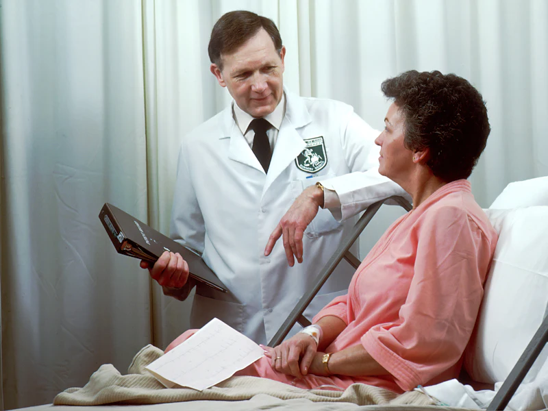 A physician discusses a home health plan with his senior patient